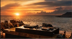 DJ setup during a sunset session